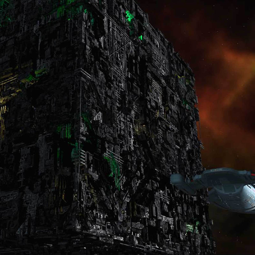 A huge Borg Cube, covered in green lights and mechanical details, looms in space as a Starfleet ship approaches