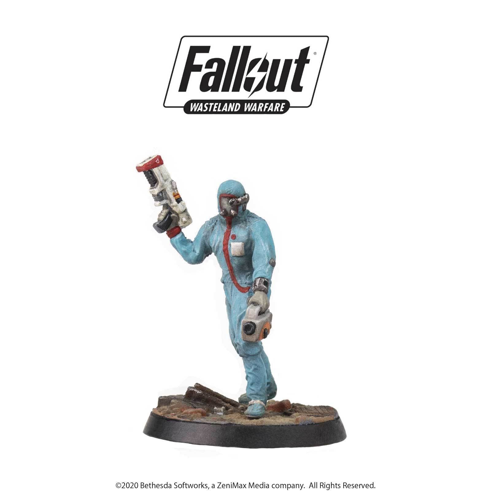 A Fallout Wasteland Warfare miniature: A blue hazmat-suited figure with goggles holds a futuristic laser rifle and a handheld device