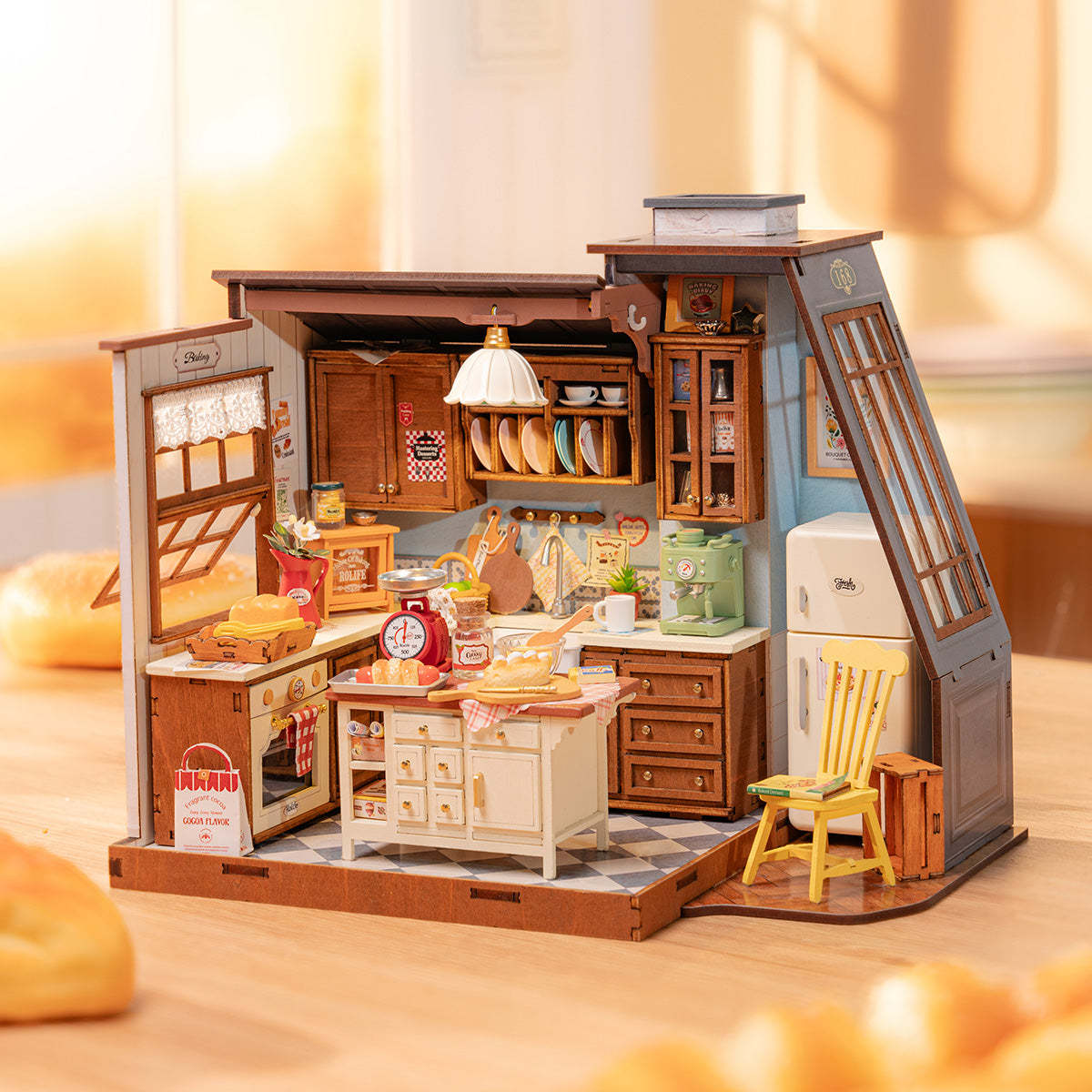 A detailed miniature wooden kitchen dollhouse kit with a tiny oven, fridge, and baking accessories