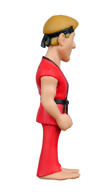 A MINIX Cobra Kai Eagle Fang Karate figure in a red karate uniform with a black belt and headband, shown in side profile
