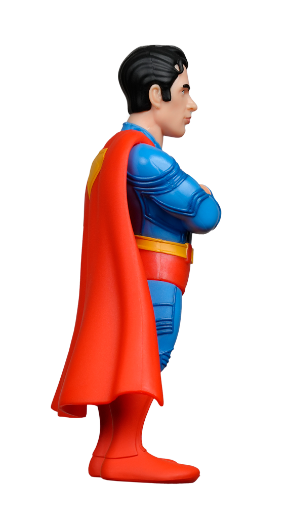 A side view of the MINIX DC Comics Superman 2025 Figure in a blue suit with red cape and boots, arms crossed