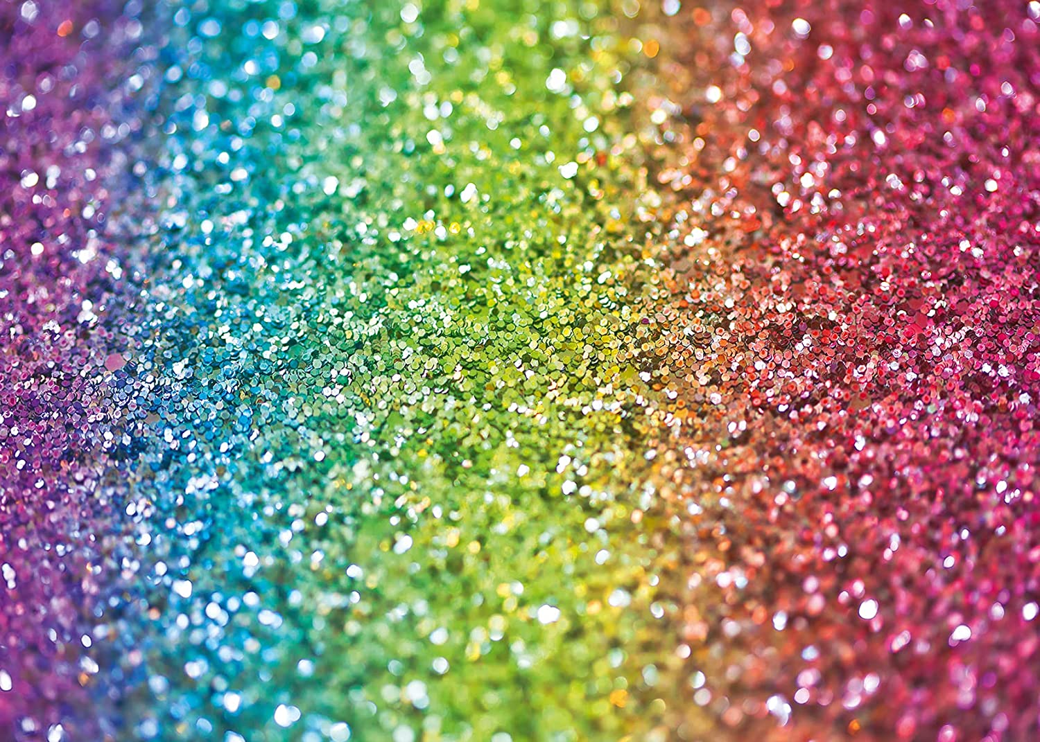 Vibrant rainbow glitter background featuring a spectrum of colors from purple blue green yellow orange to pink with sparkling sequins