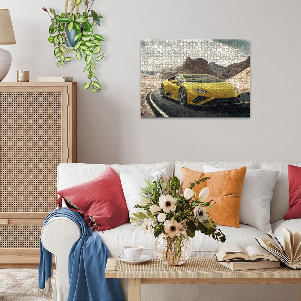 Yellow sports car jigsaw puzzle art hanging over a white sofa in a modern living room