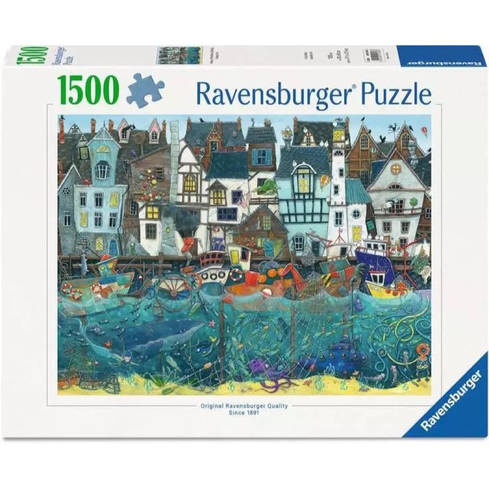 A 1500 piece jigsaw puzzle box depicting a vibrant harbor town with colorful houses, boats, and detailed underwater sea life including a whale and octopus