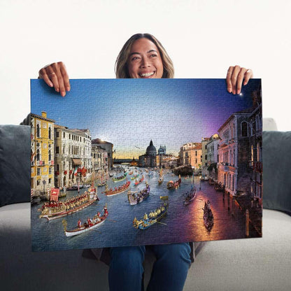 A woman proudly displays the finished 1000-piece Ravensburger Venice by Night jigsaw puzzle showing the Grand Canal filled with historic boats