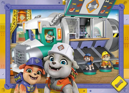 Ravensburger Rubble & Crew jigsaw puzzle art features Rubble and construction pups smiling in front of their large teal and gray mobile command unit