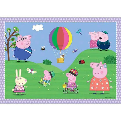 A cheerful Peppa Pig illustration depicting the family and Rebecca Rabbit enjoying a sunny picnic on green hills featuring a large multicolored hot air balloon and butterflies