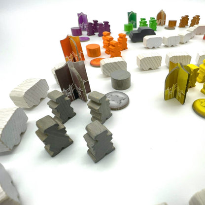 Close-up of Game components including money, pieces, and tokens in game setup