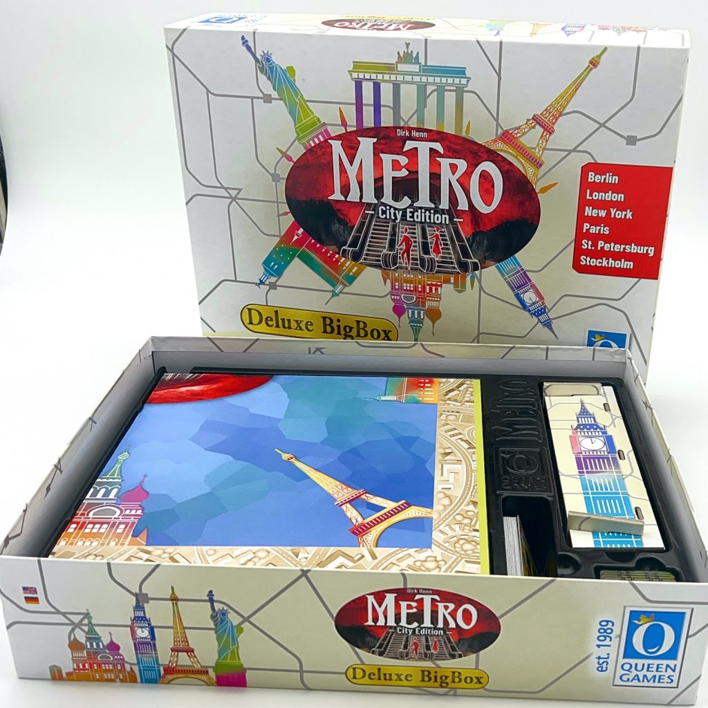 Box interior showing organized compartments for game components