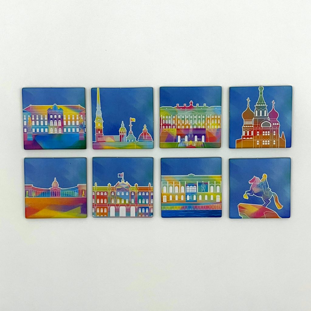 Cards and tiles laid out with city-themed illustrations