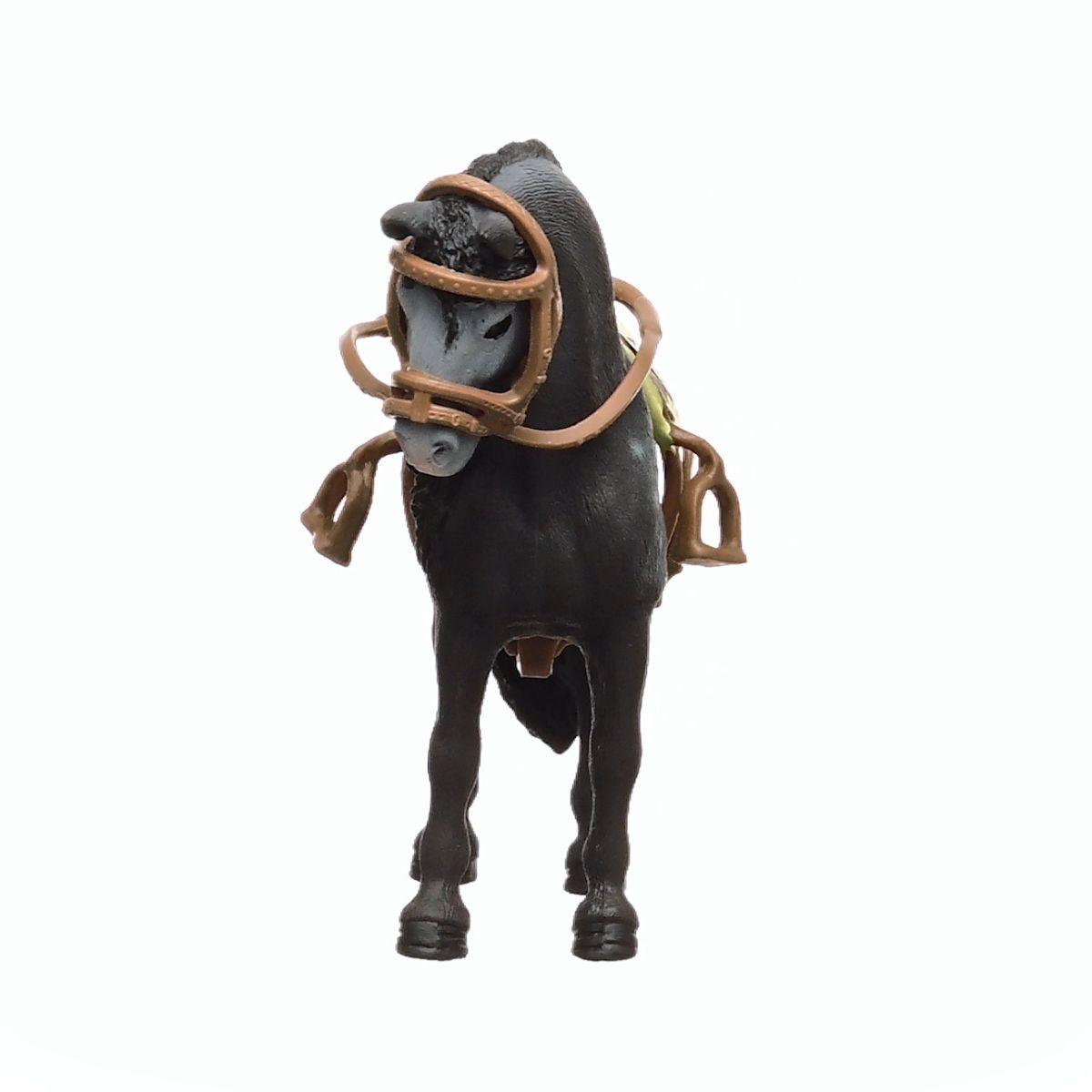 A black Pura Raza Espanola mare toy stands facing forward wearing a brown saddle and bridle