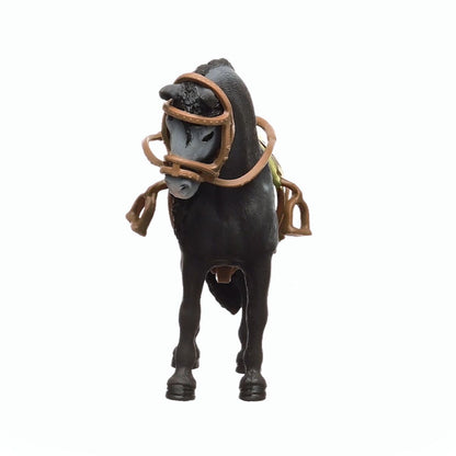 A black Pura Raza Espanola mare toy stands facing forward wearing a brown saddle and bridle