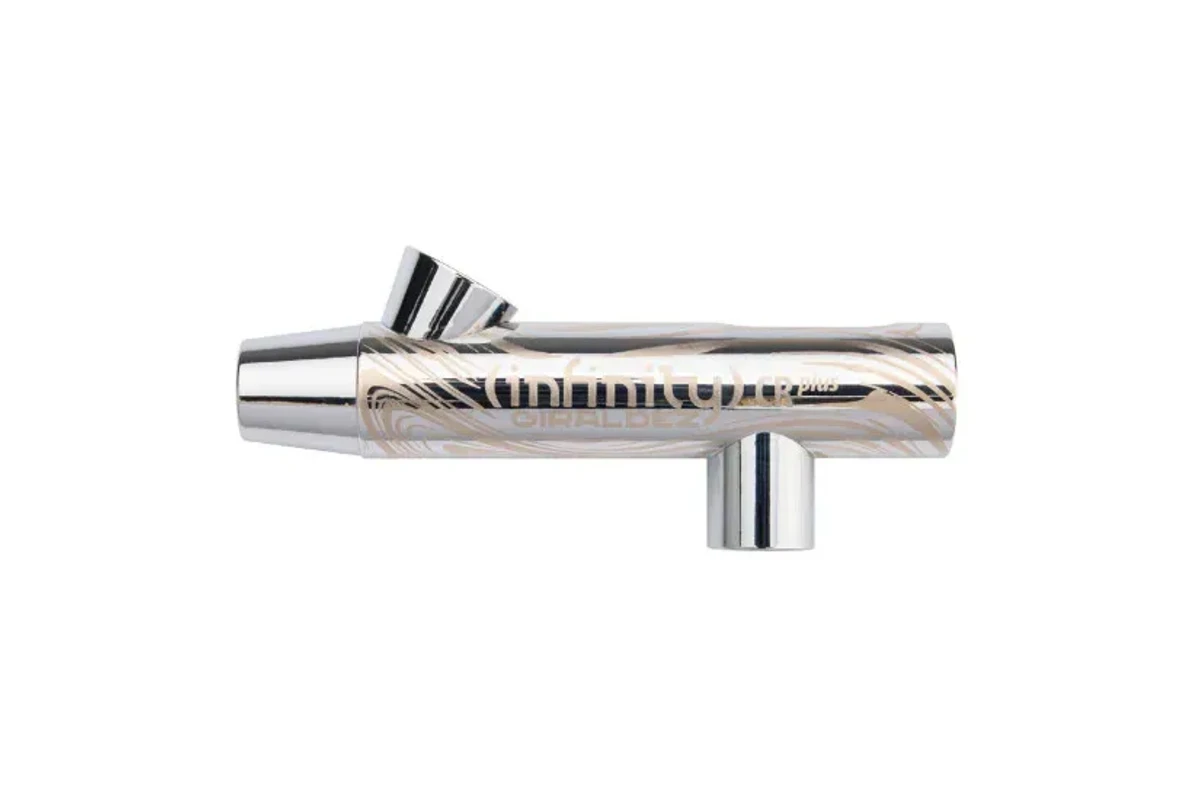 A chrome airbrush body with a light tan wavy pattern, featuring a nozzle on one end and a control lever on top