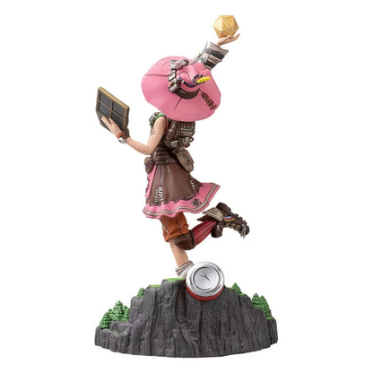 Tiny Tina figure holding a golden d20 die and a book, dynamically posed on a rocky base