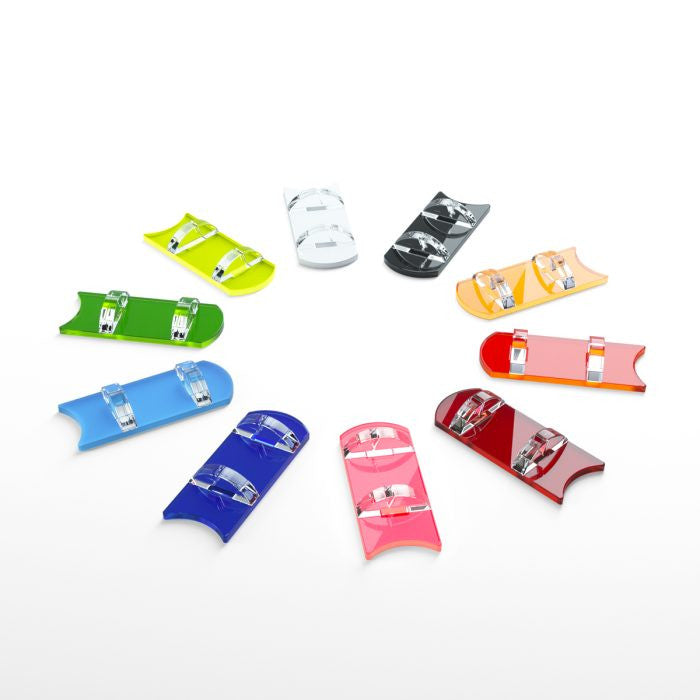 Colorful snowboard-shaped bottle openers with clear bindings arranged in a circle