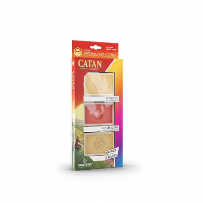A colorful box of Gamegenic Catan Art Sleeves displaying gold and red card sleeves for game cards