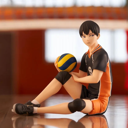 Figure of Tobio Kageyama sitting in uniform holding a volleyball