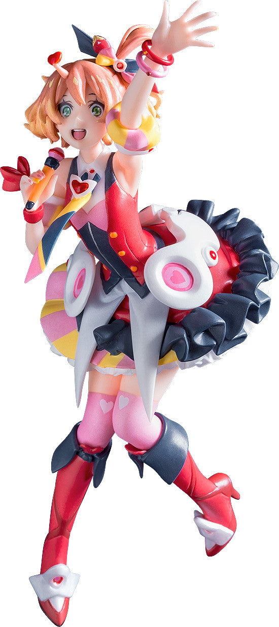 Colorful anime figure of a girl with orange hair pink socks red boots and a microphone in her hand