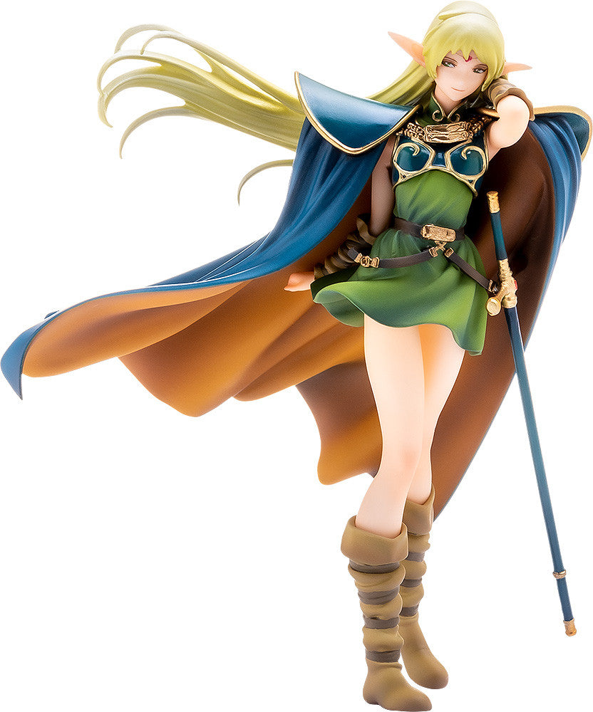 Statue of a blonde elf in a green dress and blue cape holding a staff