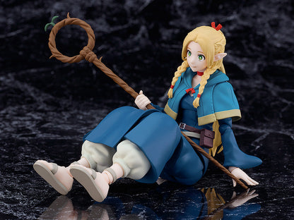 Good Smile Company Delicious in Dungeon figma Marcille figure posed sitting on a dark marbled surface holding a wooden staff with a green leaf accent
