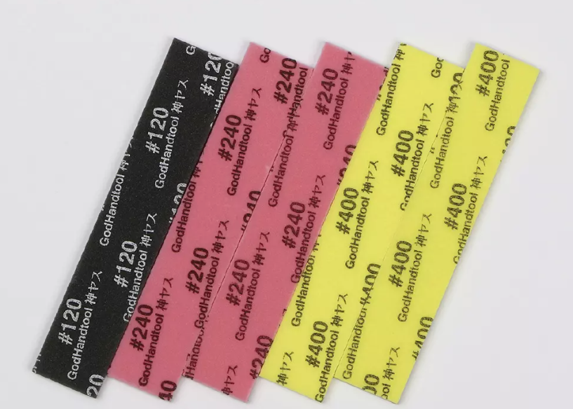 Assorted GodHandtool sanding strips: black #120, red #240, yellow #400 grit