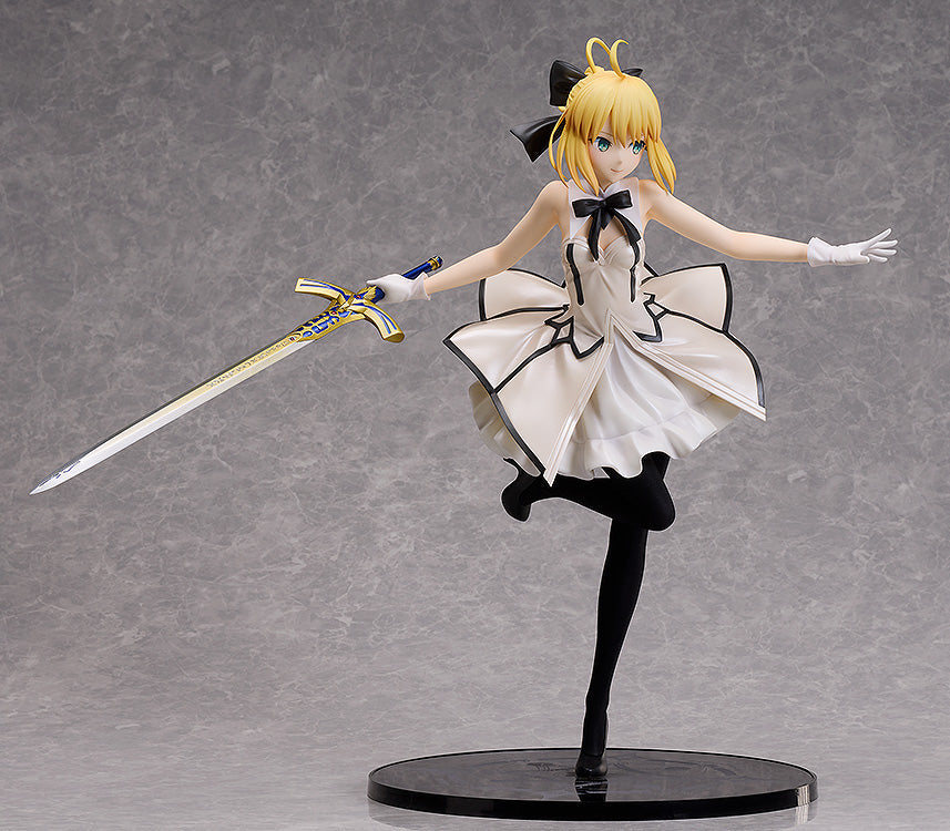 Good Smile Company FateGrand Order Saber Altria Pendragon Lily 14 scale figure in a white dress black bow and holding a gold and blue sword