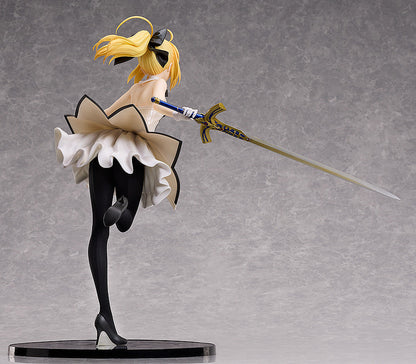 Good Smile Company FateGrand Order SaberAltria Pendragon Lily 14 scale figure with blonde hair black bow white ruffled dress and black tights holding a golden sword