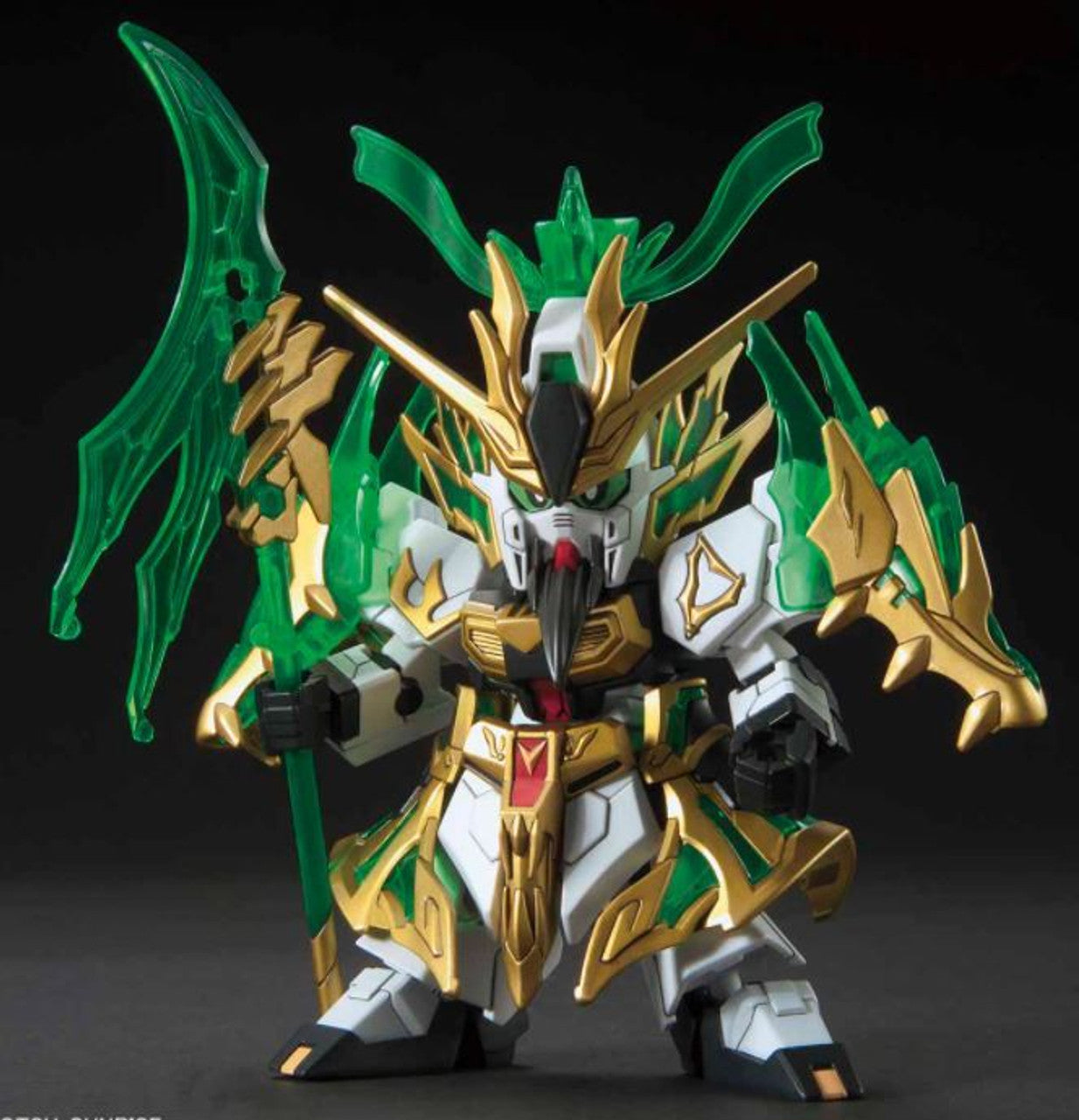 Ornate SD mecha model in white, gold and translucent green armor, holding a large green glaive