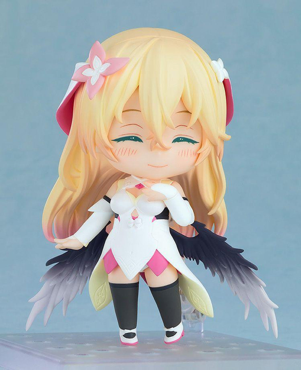 Nendoroid Rinne figure from Why Doesn't Anybody Remember Me In This World wearing a white dress with pink accents and black wings