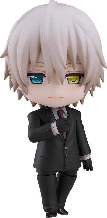 Nendoroid figure with light hair, mismatched teal and yellow eyes, in a black suit adjusting his dark red tie.