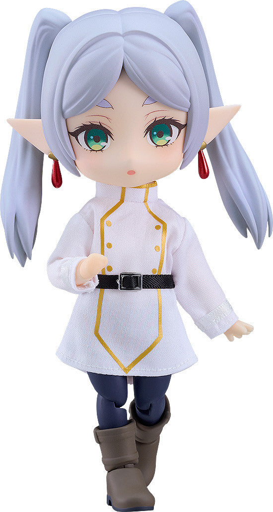 Nendoroid Doll Frieren figure from Frieren Beyond Journey's End wearing a white tunic with gold trim dark pants and brown boots