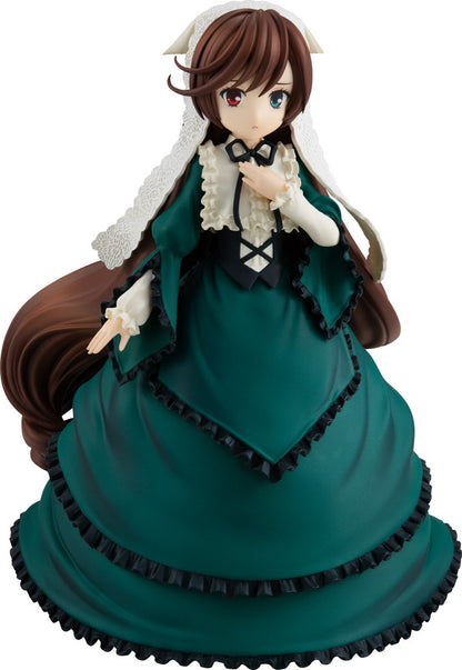 Anime figure with long brown hair and green and blue eyes wearing a dark green dress with ruffled trim
