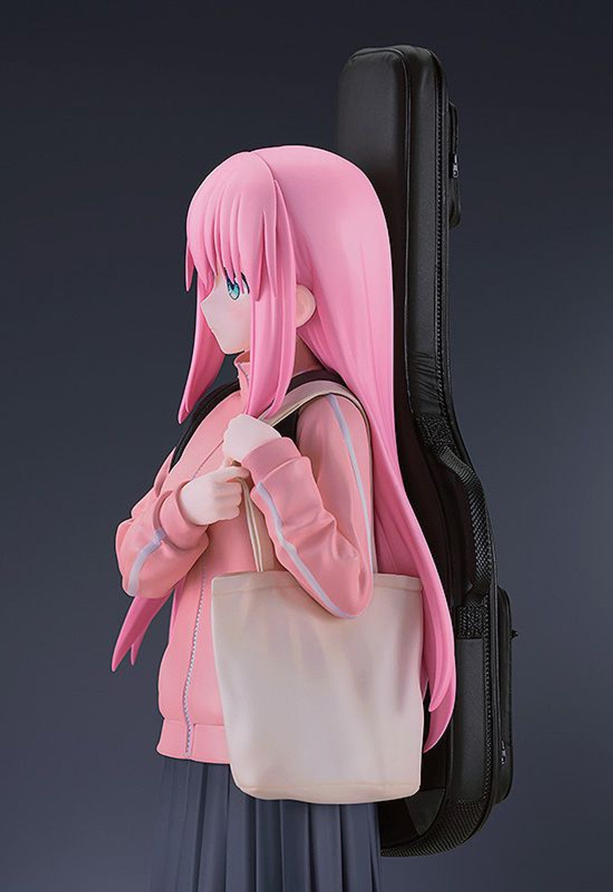 Bocchi the Rock Hitori Gotoh 17 scale figure in a pink jacket and gray skirt holding a tote bag and guitar case