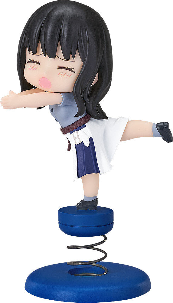 Anime figure of a dark-haired girl in a blue and white dress balanced on a spring base