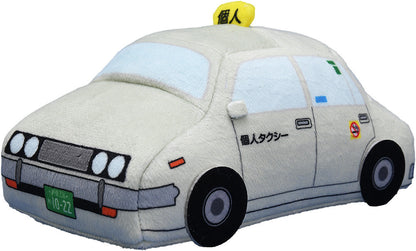 Light gray plush taxi toy with yellow individual taxi sign on roof and Japanese writing on door