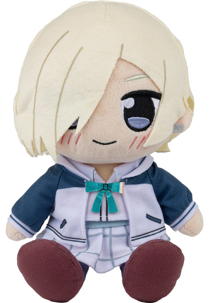Plush doll with light blonde hair blue eyes wearing a navy blue and white jacket and plaid skirt