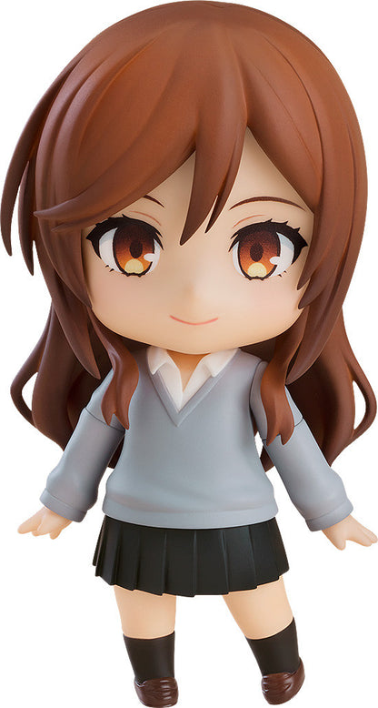 Nendoroid figure of a brown-haired girl in a gray sweater and black pleated skirt