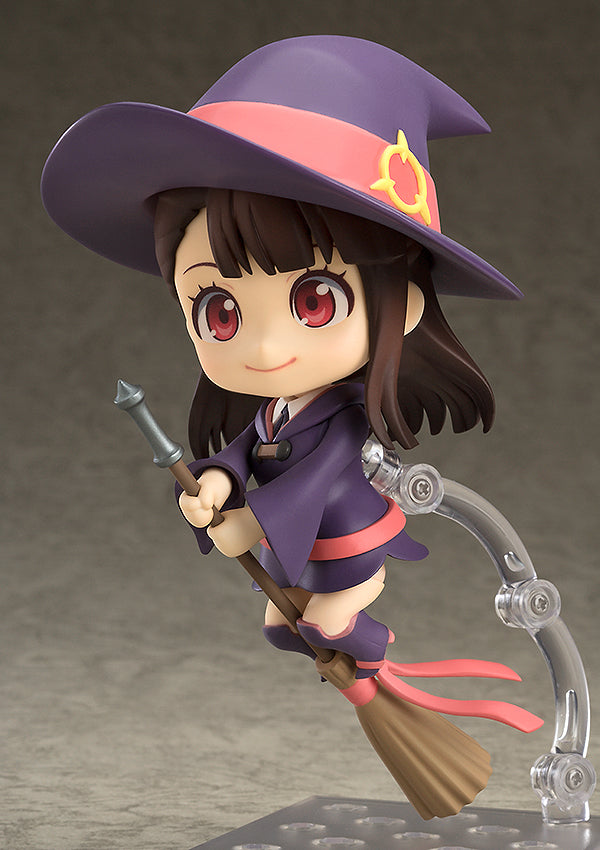 Akko Kagari Nendoroid figure from Little Witch Academia in purple and pink uniform flying on a broom