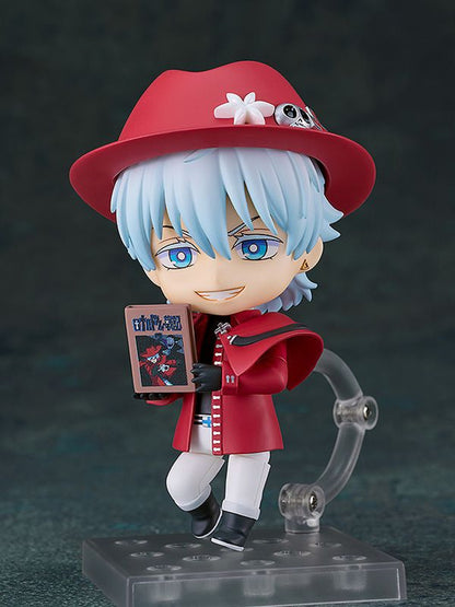Nendoroid Ronald Mebiyatsu holding a book wearing a red hat with white flower and skull pin and a red coat