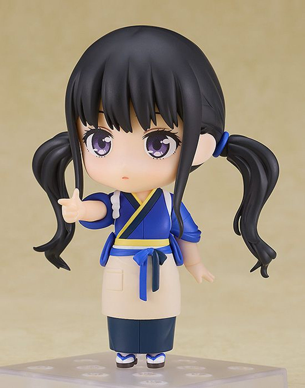 Lycoris Recoil Nendoroid of Takina Inoue in Cafe LycoReco uniform featuring blue jacket and skirt with beige apron pointing forward