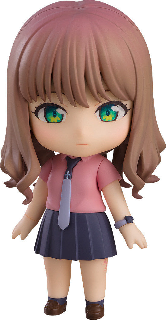 Nendoroid doll of a girl with brown hair pink shirt blue skirt and brown shoes on white background