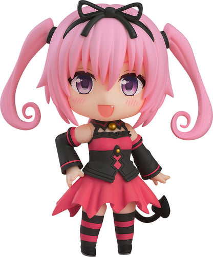 Figure with pink hair in pigtails black bow and black and pink dress with tail on white background