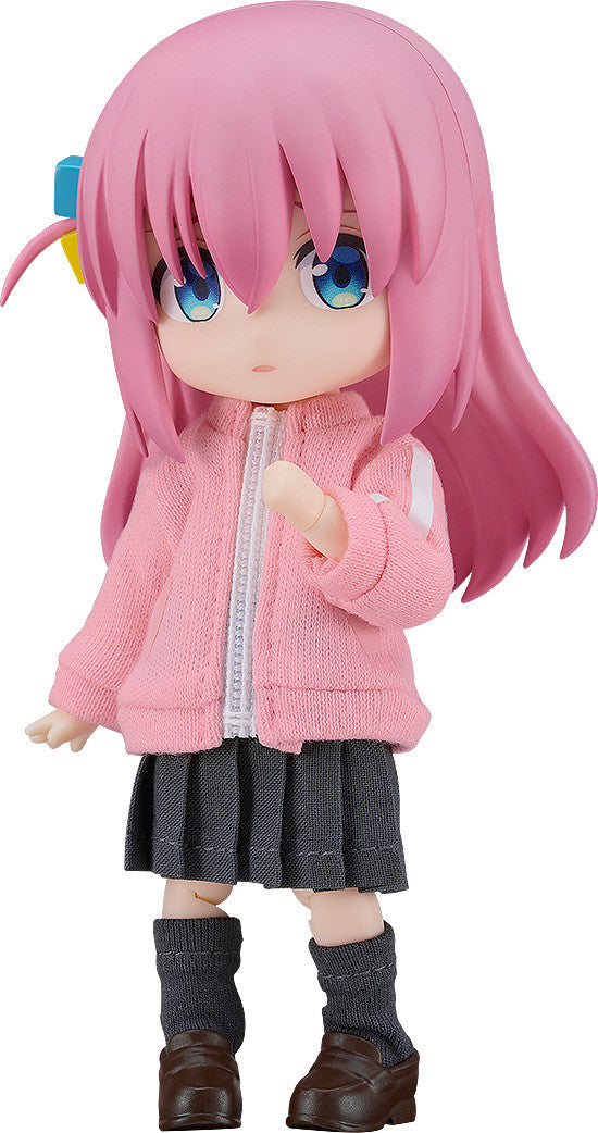 Nendoroid of Bocchi the Rock's Hitori Gotou in a pink jacket gray skirt and dark gray socks on white background
