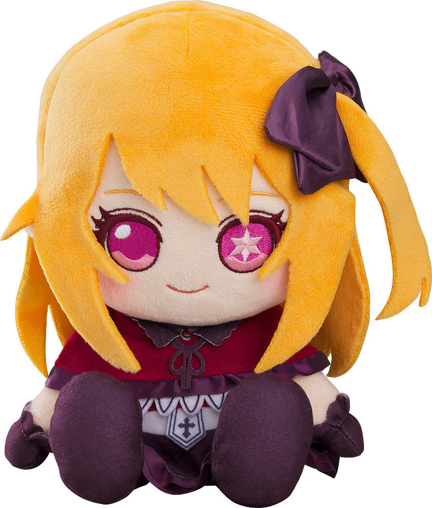 Chibi character plush toy with yellow-orange hair, purple bow, pink star eyes, and a red-purple dress