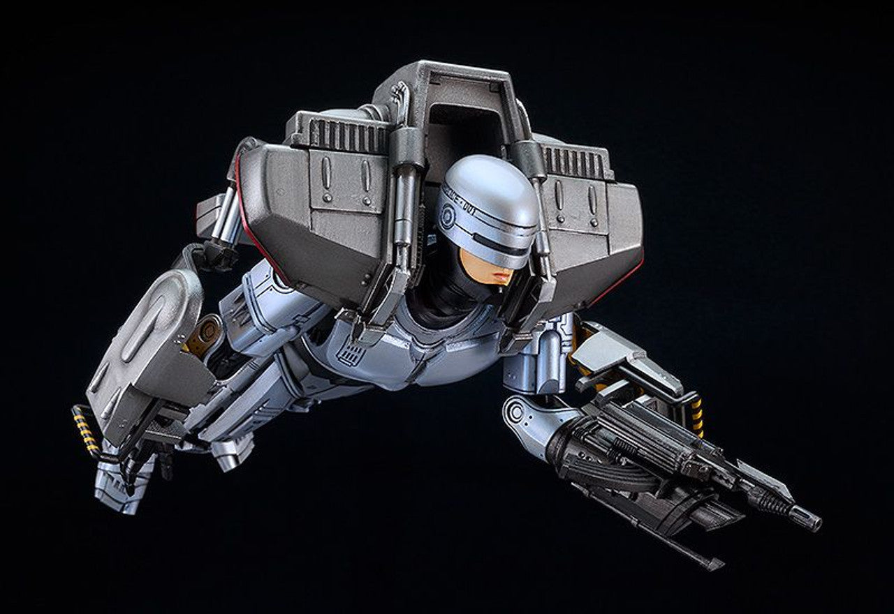 Moderoid Robocop 3 figure in silver and gray armor with jetpack and attached rifle posed flying on a black background
