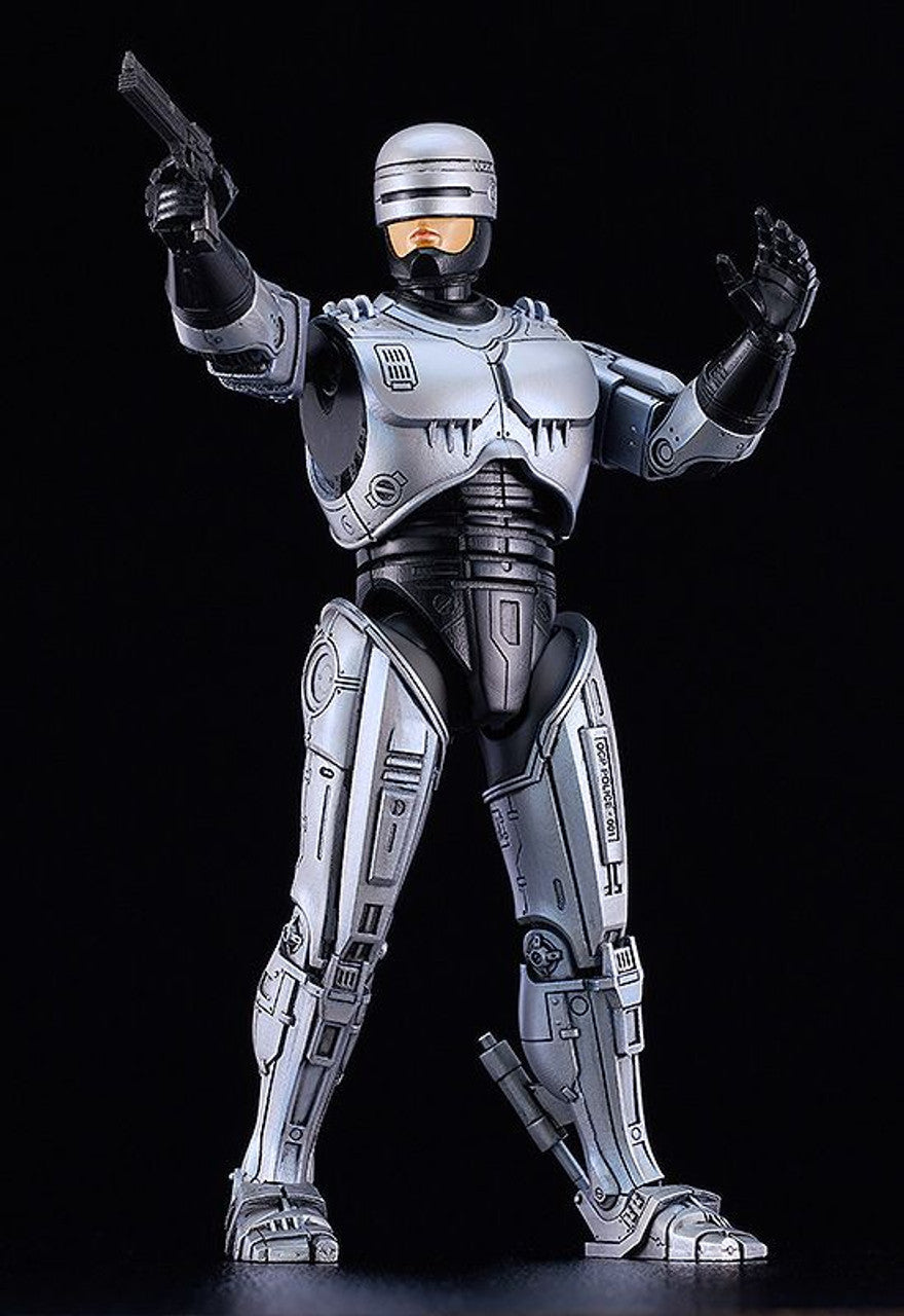 MODEROID Robocop figure with jetpack equipment standing on black background holding pistol and raising left hand