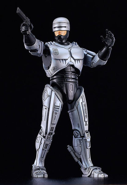 MODEROID Robocop figure with jetpack equipment standing on black background holding pistol and raising left hand