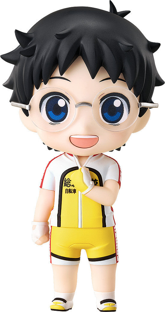 A chibi anime figure with black hair and glasses, smiling in a white, red, and yellow cycling uniform