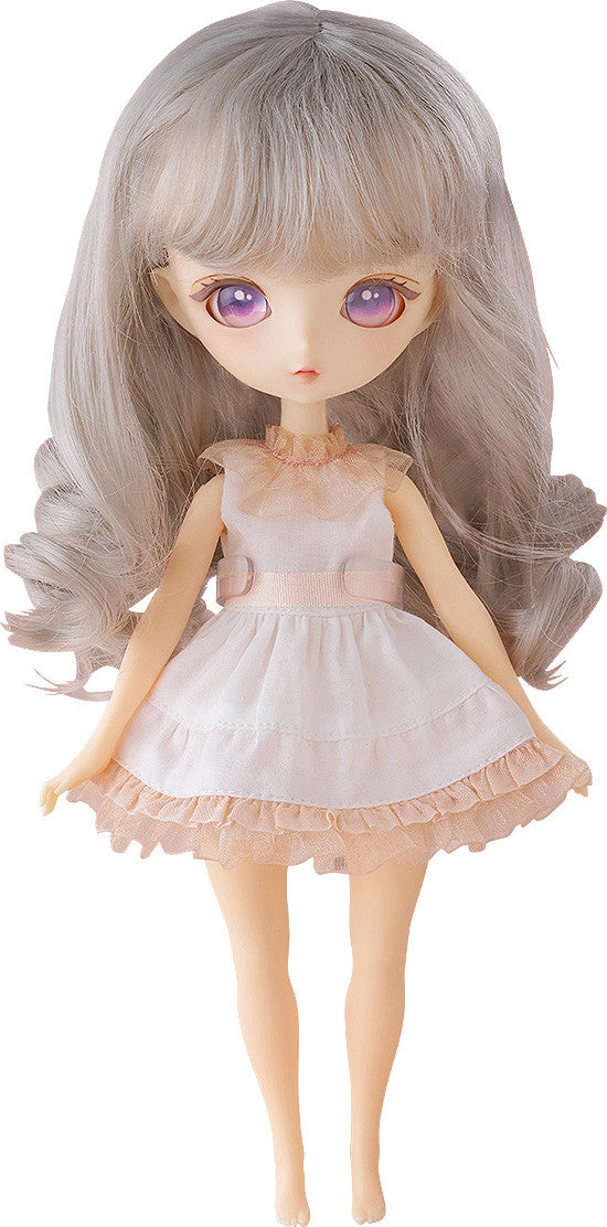 Mellow fashion doll with soft pastel outfit and calm expression