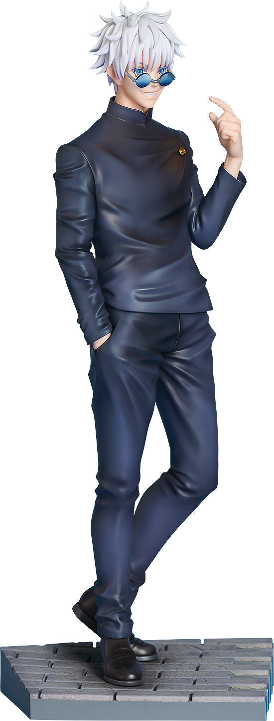 A Satoru Gojo figure from Jujutsu Kaisen, with white spiky hair and blue round glasses, wearing a dark uniform, smiling with one hand in his pocket and the other raised on a gray base